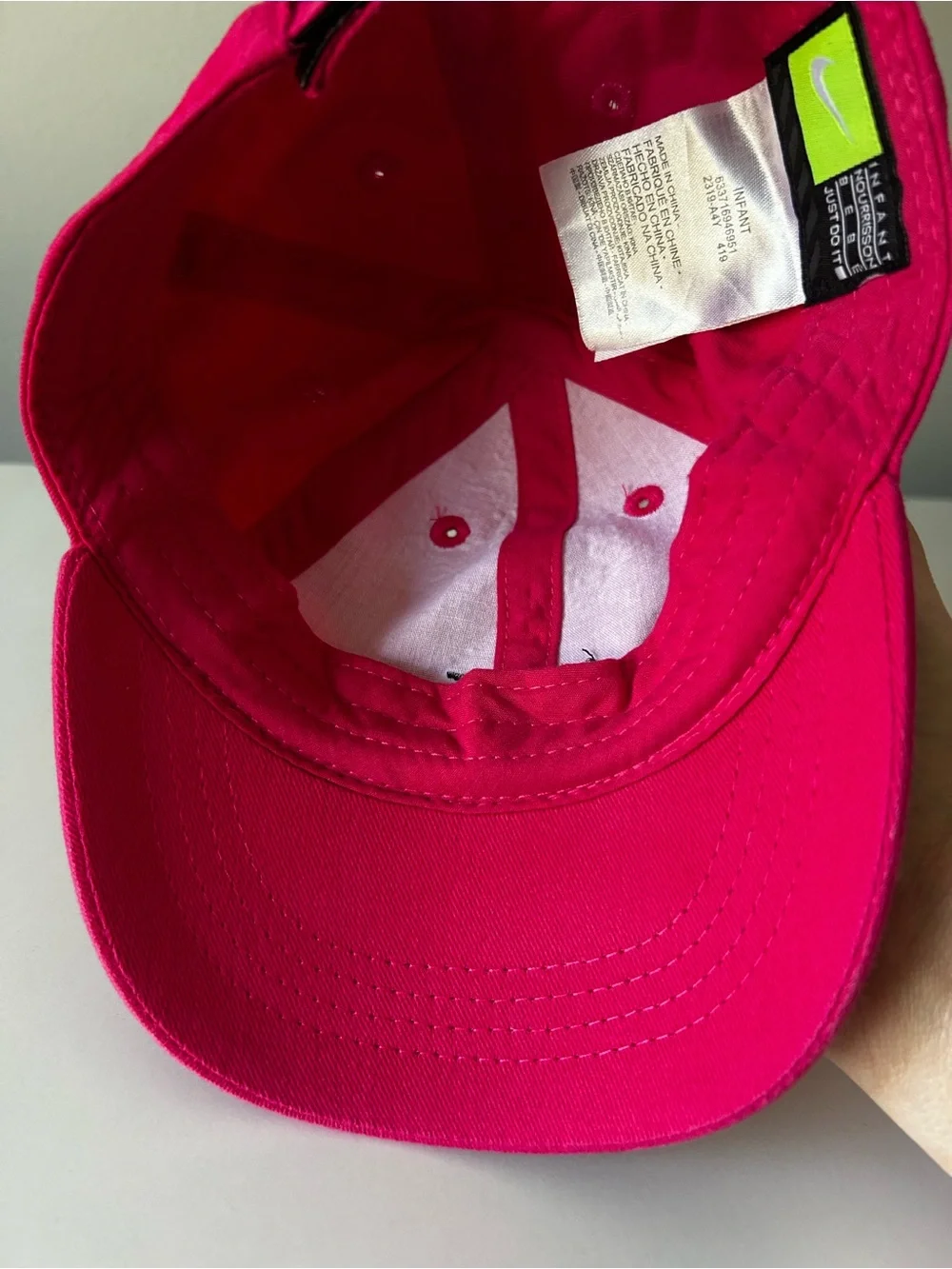 Infant hot pink with black Nike check baseball hate